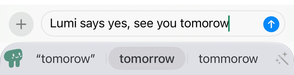 A draft reading “Lumi says yes, see you tomorow” above the suggestion bar, which shows “tomorow” in quotes, then tomorrow highlighted, then tommorow.